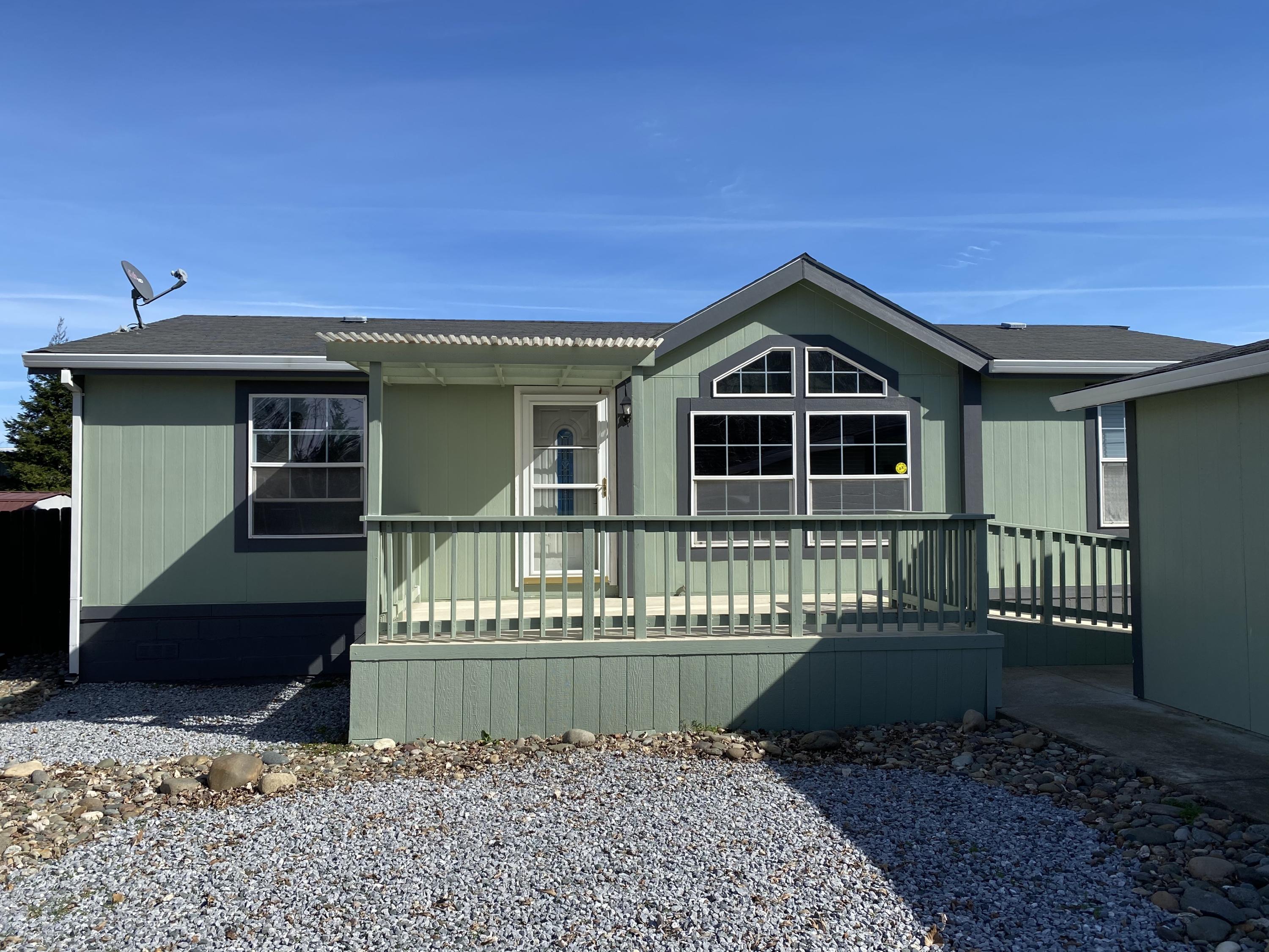 4935 Cedars Road Redding, CA 96001 - Photo 2 of 18 a front view of a house with a garden