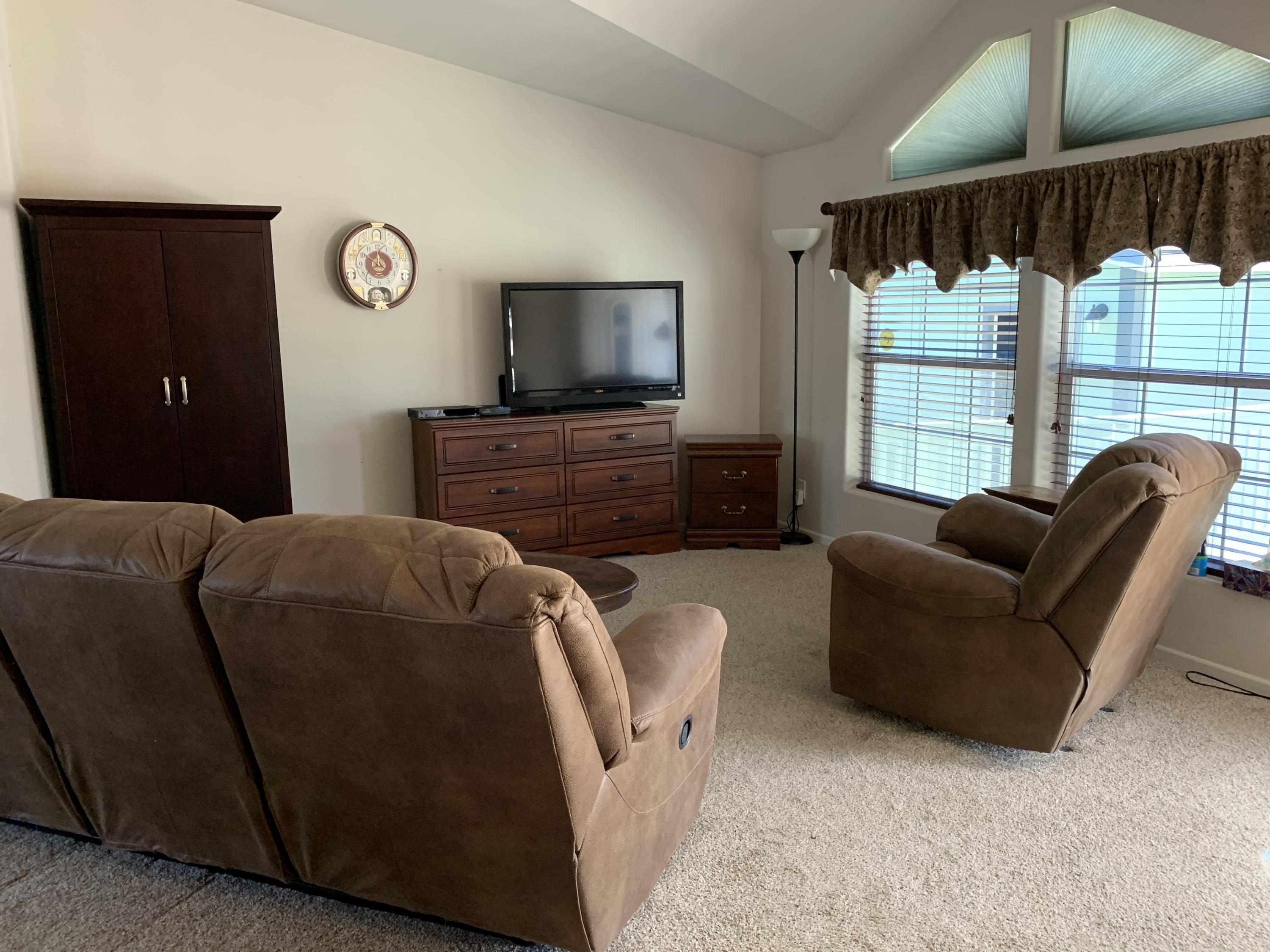 4935 Cedars Road Redding, CA 96001 - Photo 3 of 18 a living room with furniture and a flat screen tv