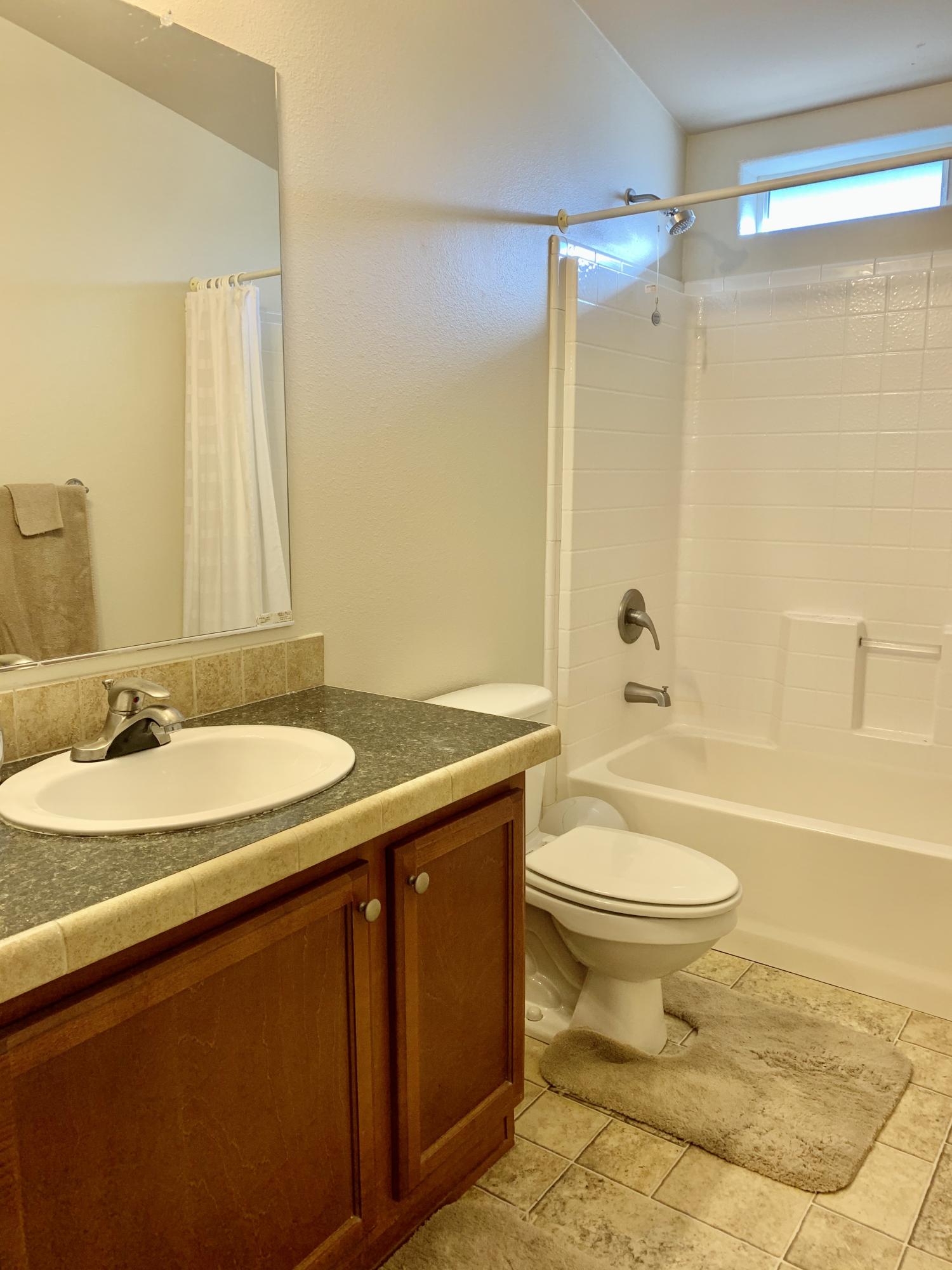 4935 Cedars Road Redding, CA 96001 - Photo 10 of 18 a bathroom with a sink toilet and shower