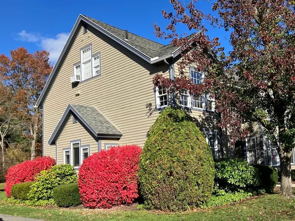 a view of a house with a small yard