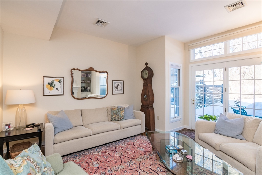 63 Amity Place, Unit 63 Amherst, MA 01002 - Photo 15 of 42 a living room with furniture and a large window