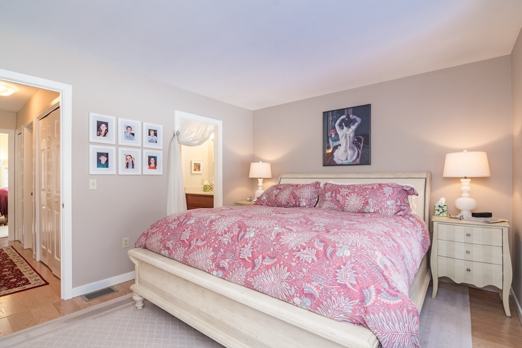 63 Amity Place, Unit 63 Amherst, MA 01002 - Photo 17 of 42 a bedroom with a bed and a night stand