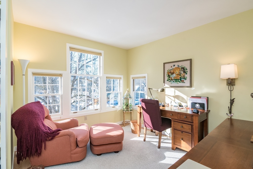 63 Amity Place, Unit 63 Amherst, MA 01002 - Photo 23 of 42 a living room with furniture and a large window