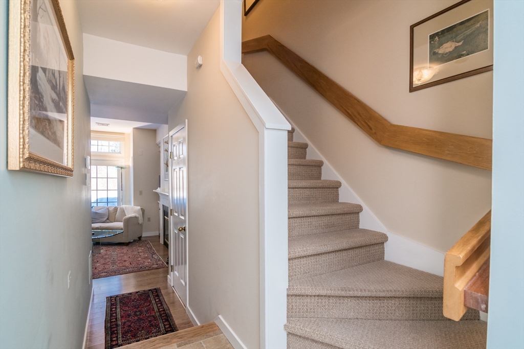 63 Amity Place, Unit 63 Amherst, MA 01002 - Photo 5 of 42 a view of room with stairs and wooden floor