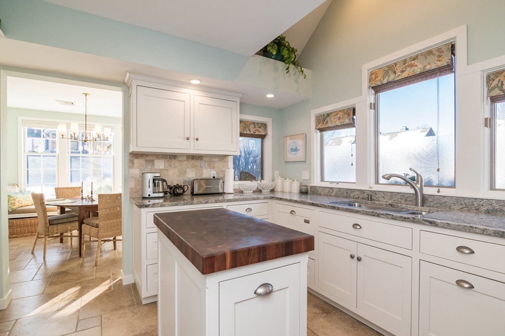 63 Amity Place, Unit 63 Amherst, MA 01002 - Photo 8 of 42 a kitchen with a sink stove and cabinets