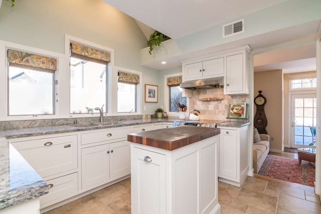 63 Amity Place, Unit 63 Amherst, MA 01002 - Photo 9 of 42 a kitchen with a sink stove and cabinets