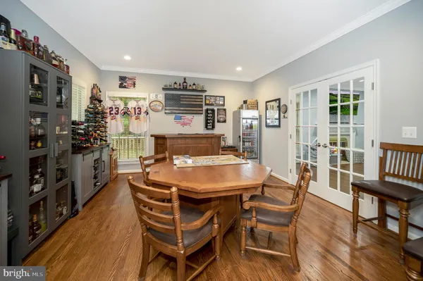 a view of living room with furniture and wooden floor