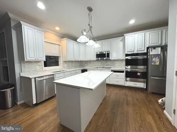 a room with furniture and a wooden floor