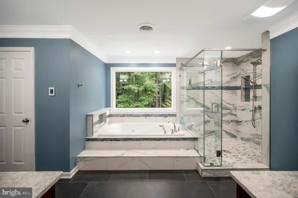 a view of a lake with houses in the background