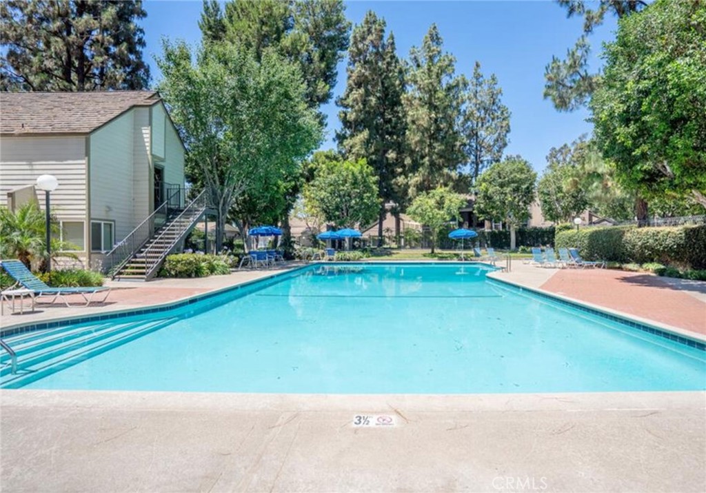 16520 Poppyglen Lane Cerritos, CA 90703 - Photo 16 of 17 a view of a swimming pool with an outdoor space