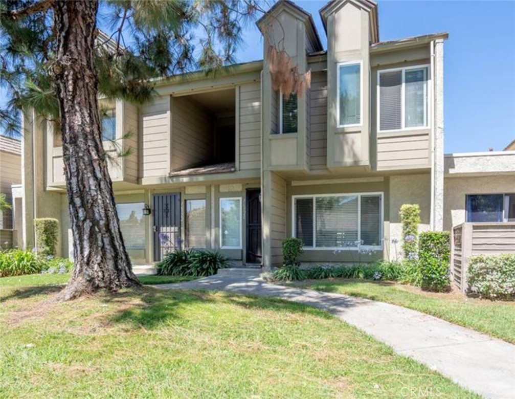 16520 Poppyglen Lane Cerritos, CA 90703 - Photo 2 of 17 a front view of a house with garden