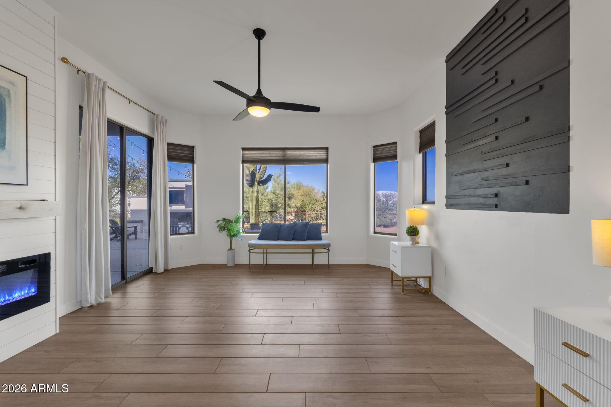 14604 East Peak View Road Scottsdale, AZ 85262 - Photo 22 of 55 a view of an empty room with a window and wooden floor