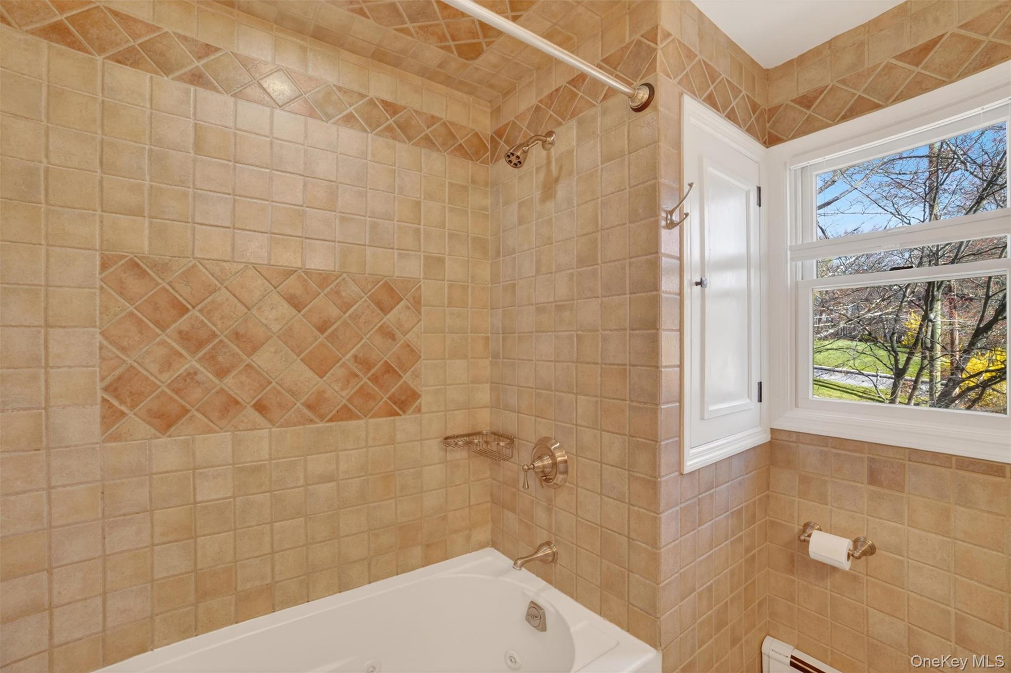 9 Ridge Road Cortlandt Manor, NY 10567 - Photo 27 of 47 Custom tiled tub surround with the deep jetted tub