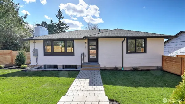 a front view of a house with a yard