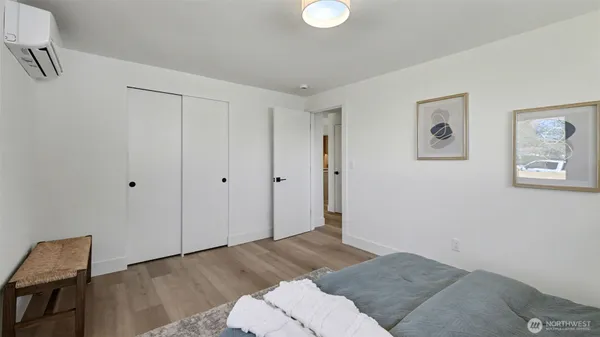 a bedroom with a bed and cabinets