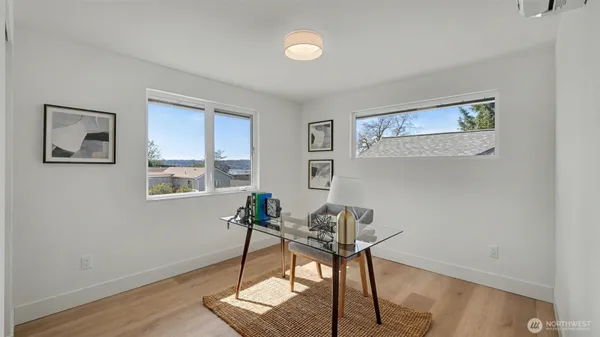a workspace with furniture and a window