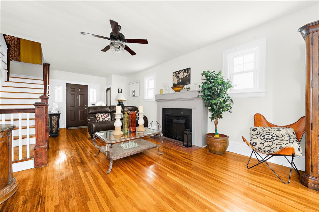 2055 Ferry Street Wilson, PA 18042 - Photo 2 of 21 This inviting living space features gleaming hardwood floors and a cozy fireplace, perfect for daily relaxation.