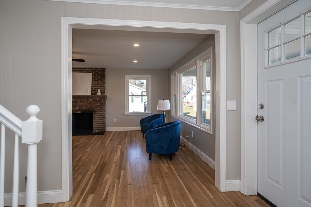 2026 Cross Street Three Rivers, MA 01080 - Photo 13 of 42 a living room with furniture and a fireplace