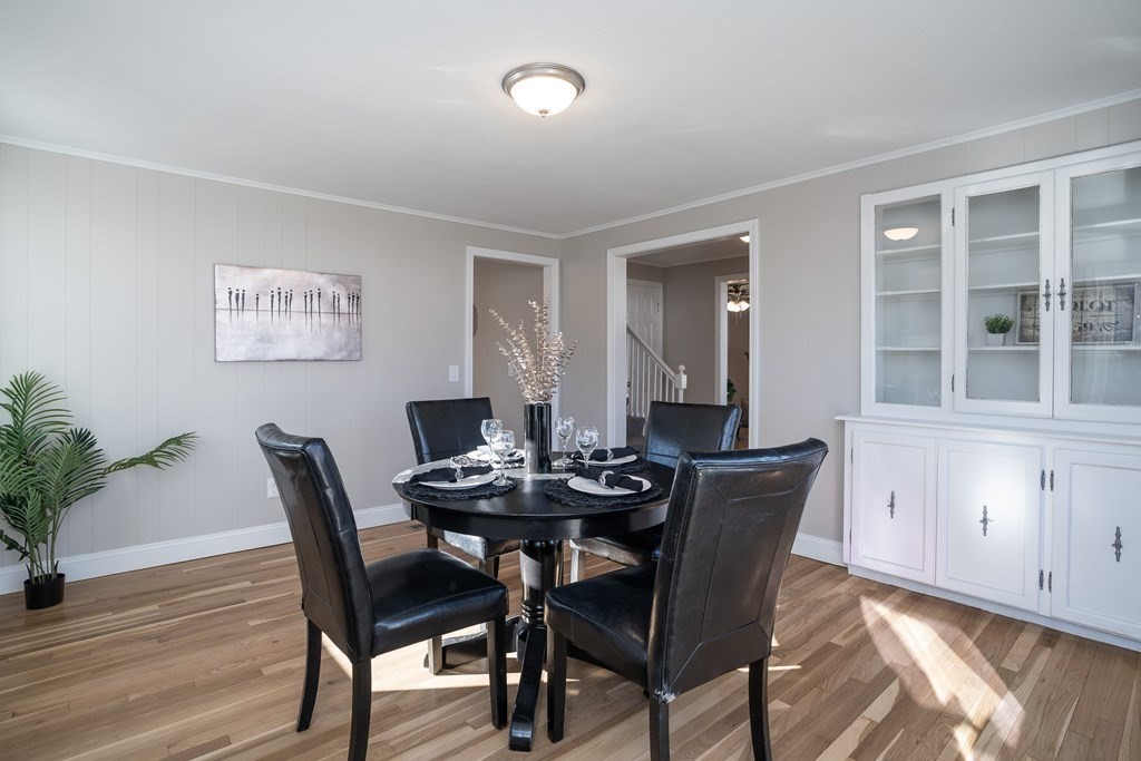 2026 Cross Street Three Rivers, MA 01080 - Photo 14 of 42 a view of a dining room with furniture and wooden floor