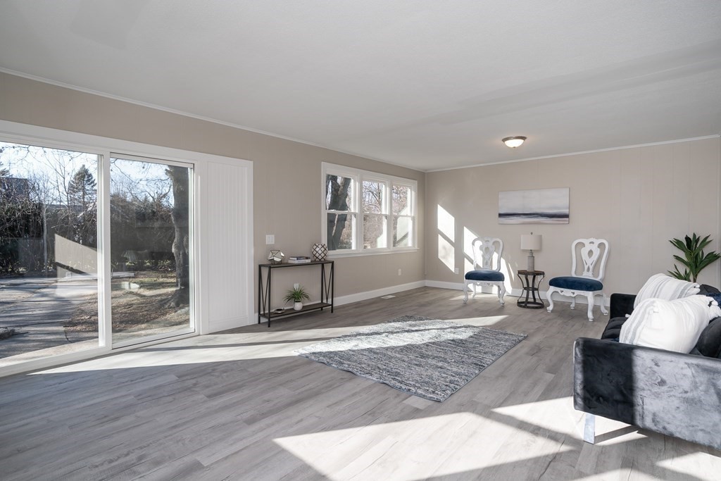 2026 Cross Street Three Rivers, MA 01080 - Photo 18 of 42 a living room with furniture window and wooden floor