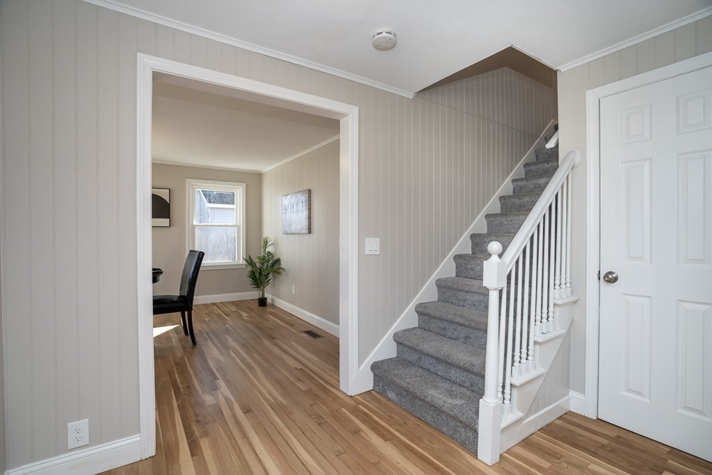 2026 Cross Street Three Rivers, MA 01080 - Photo 25 of 42 a view of a hallway with wooden floor and staircase
