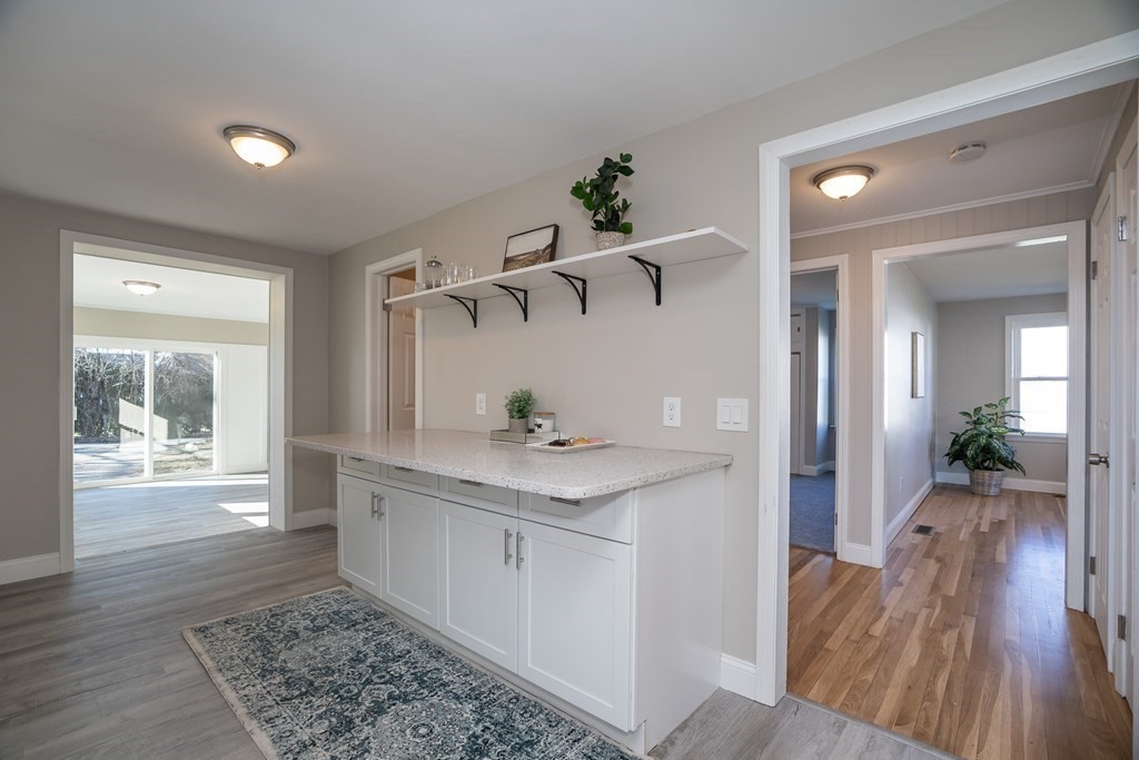 2026 Cross Street Three Rivers, MA 01080 - Photo 5 of 42 a hallway view with wooden floor and staircase