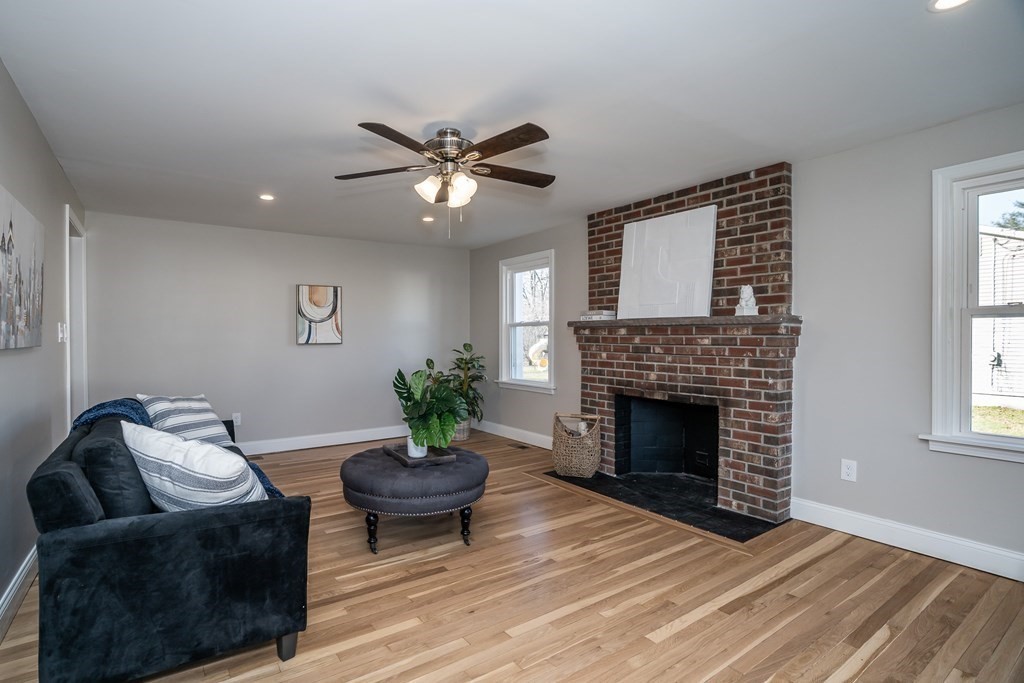 2026 Cross Street Three Rivers, MA 01080 - Photo 10 of 42 a living room with furniture and a fireplace