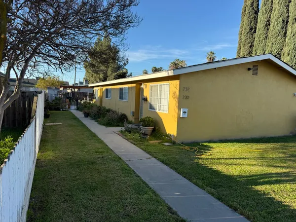 a view of a backyard with plants