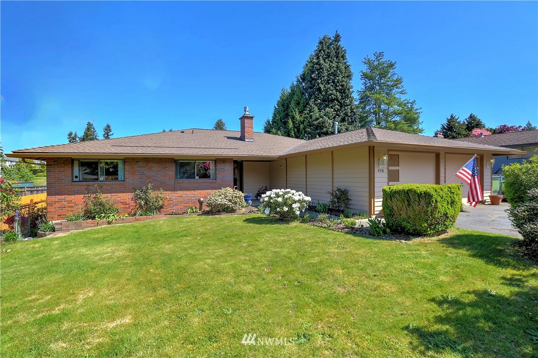 4518 Southeast 2nd Street Renton, WA 98059 - Photo 2 of 29 a view of a house with a yard