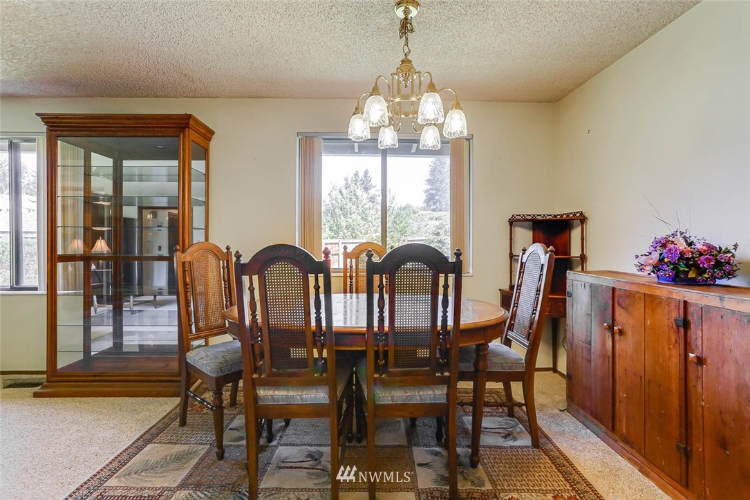 4518 Southeast 2nd Street Renton, WA 98059 - Photo 11 of 29 a view of a dining room with furniture window and outside view