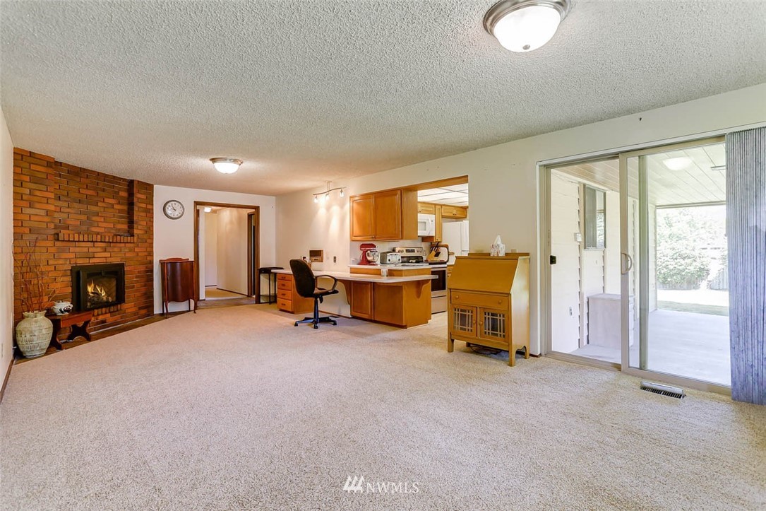 4518 Southeast 2nd Street Renton, WA 98059 - Photo 16 of 29 a view of a livingroom with furniture and a fireplace