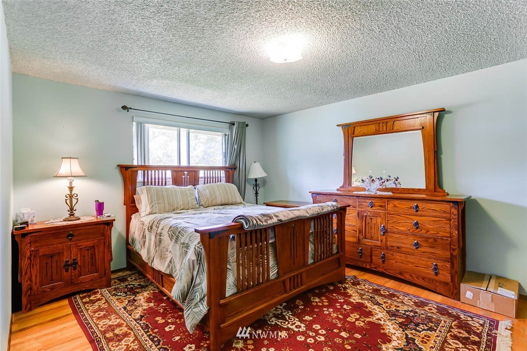 4518 Southeast 2nd Street Renton, WA 98059 - Photo 19 of 29 a bed room with a bed and a window