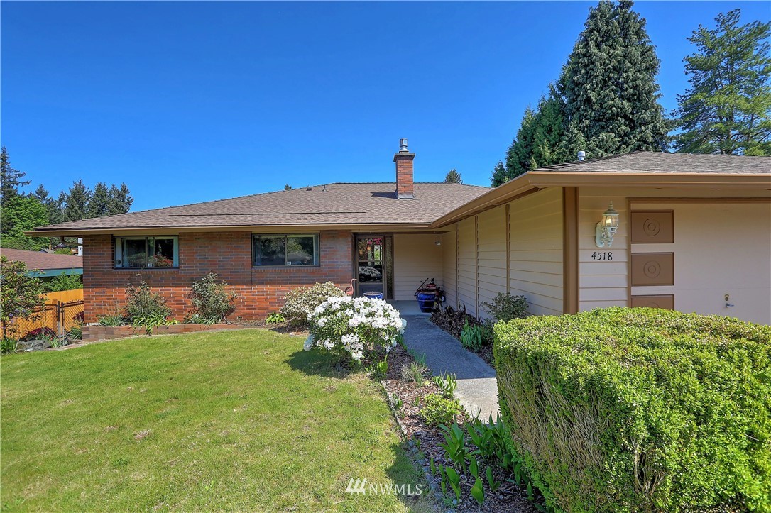 4518 Southeast 2nd Street Renton, WA 98059 - Photo 3 of 29 a front view of a house with a yard and porch