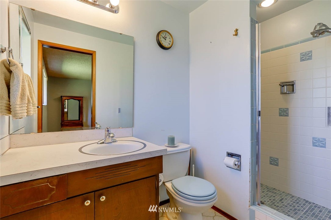 4518 Southeast 2nd Street Renton, WA 98059 - Photo 21 of 29 a bathroom with a sink a toilet and shower