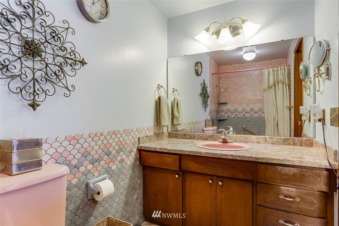 4518 Southeast 2nd Street Renton, WA 98059 - Photo 22 of 29 a bathroom with a sink vanity and a mirror