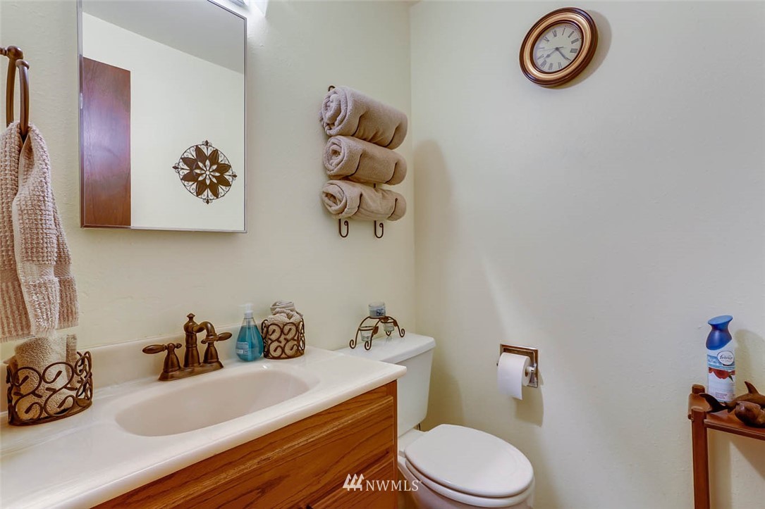 4518 Southeast 2nd Street Renton, WA 98059 - Photo 23 of 29 a bathroom with a sink a mirror and toilet