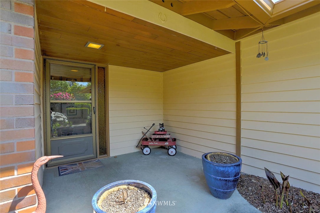 4518 Southeast 2nd Street Renton, WA 98059 - Photo 5 of 29 a car parked in front of a glass door
