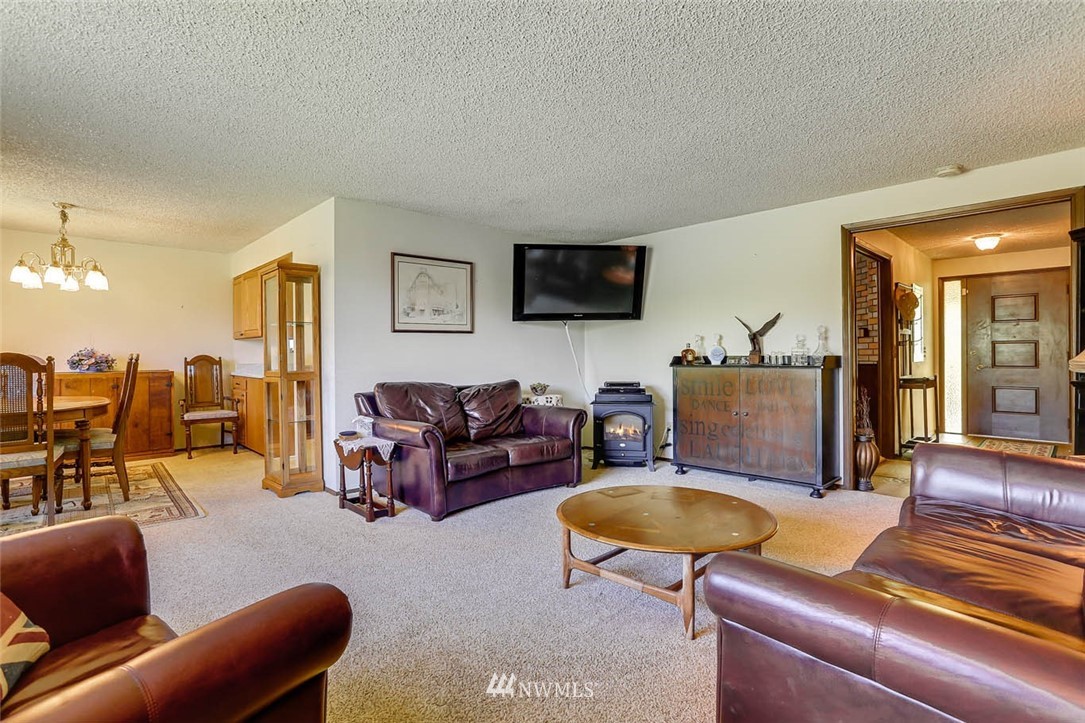 4518 Southeast 2nd Street Renton, WA 98059 - Photo 8 of 29 a living room with furniture and a flat screen tv