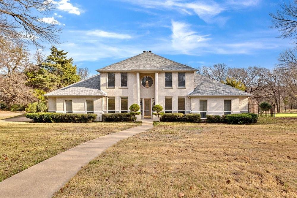 a front view of a house with yard