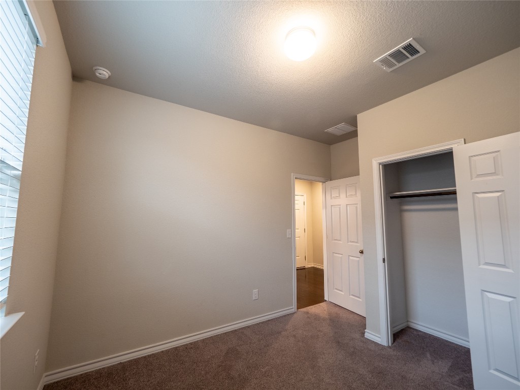 1320 Eagle Ray Street Leander, TX 78641 - Photo 13 of 30 an empty room with closet and windows
