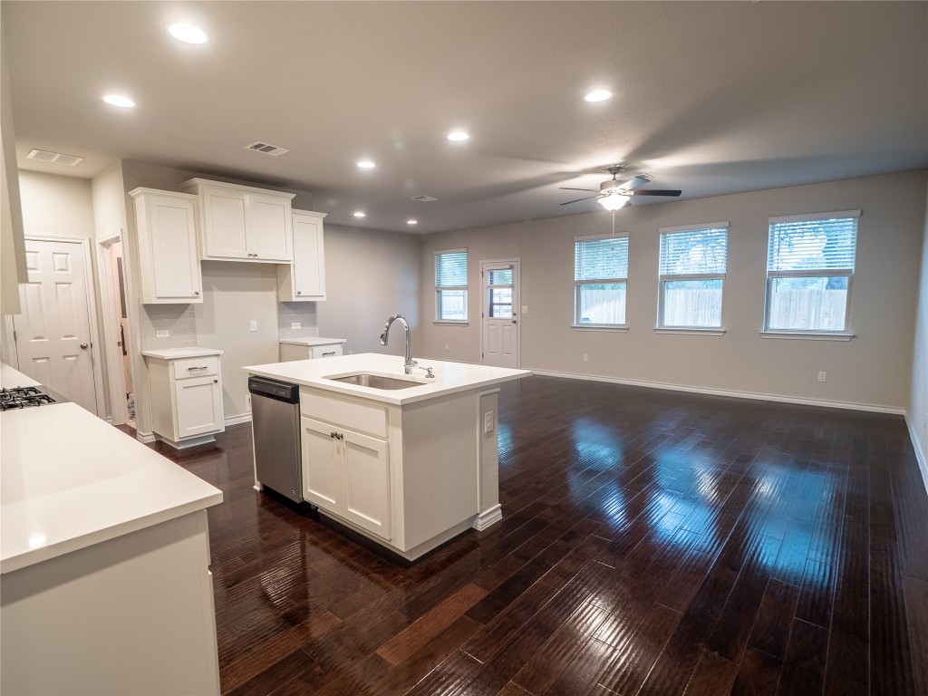 1320 Eagle Ray Street Leander, TX 78641 - Photo 5 of 30 a kitchen with a sink window and cabinets