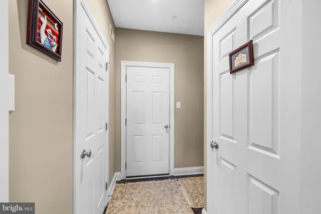 a bathroom with a sink mirror and toilet
