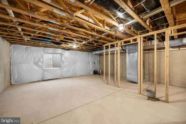a view of an empty room with furniture