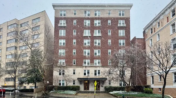 a view of a building with a street