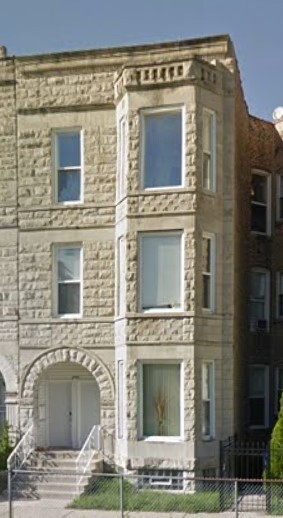 a view of a brick house with windows