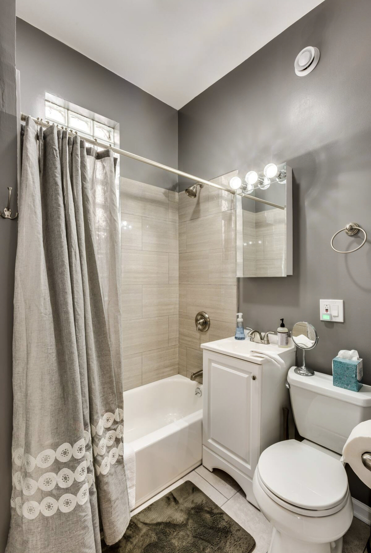 3140 West Fulton Street Chicago, IL 60612 - Photo 12 of 23 a bathroom with a sink toilet and shower