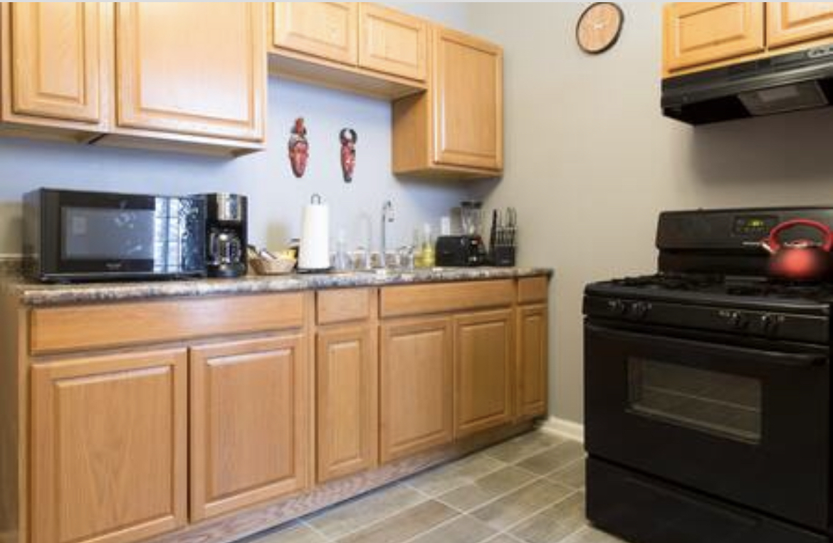 3140 West Fulton Street Chicago, IL 60612 - Photo 15 of 23 a kitchen with stainless steel appliances granite countertop a stove microwave and sink