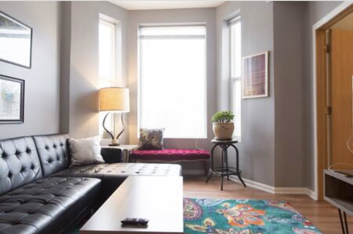 3140 West Fulton Street Chicago, IL 60612 - Photo 17 of 23 a living room with furniture and wooden floor
