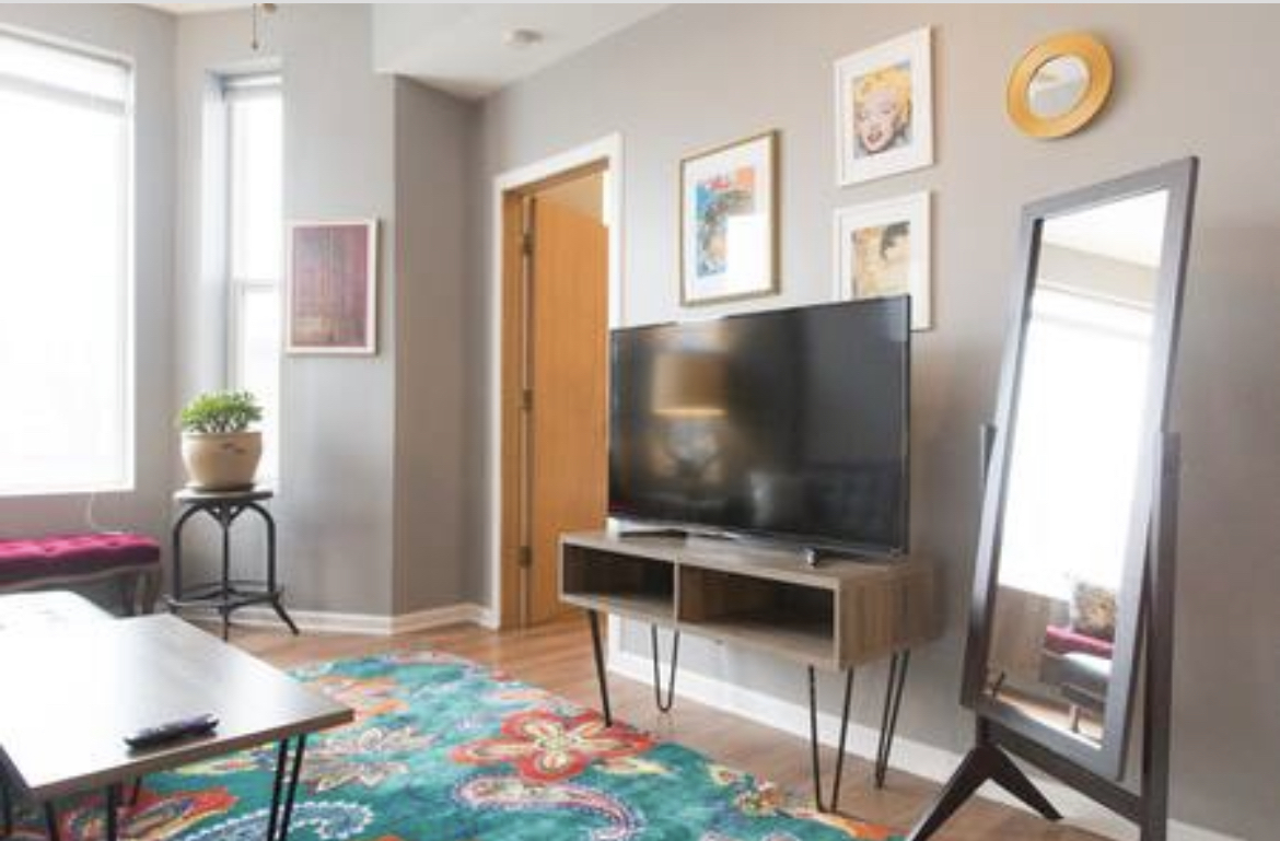 3140 West Fulton Street Chicago, IL 60612 - Photo 19 of 23 a living room with furniture and a flat screen tv