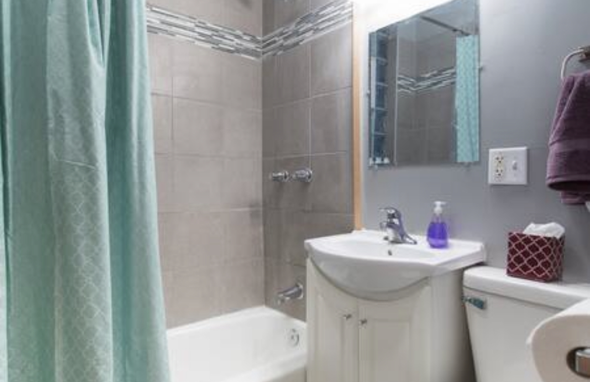 3140 West Fulton Street Chicago, IL 60612 - Photo 23 of 23 a bathroom with a sink toilet and shower